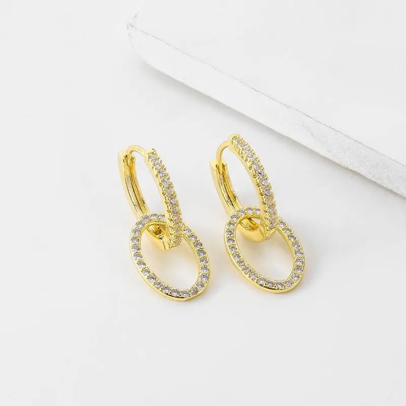 Boucles d'oreilles Ramiart en zircon doré, style coréen avec double anneau croisé, parfaites pour une touche d'élégance quotidienne.